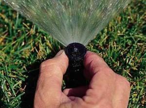 readjusting a sprinkler head